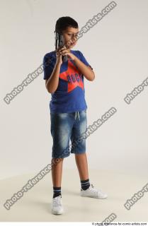 TIMBO STANDING POSE WITH GUN